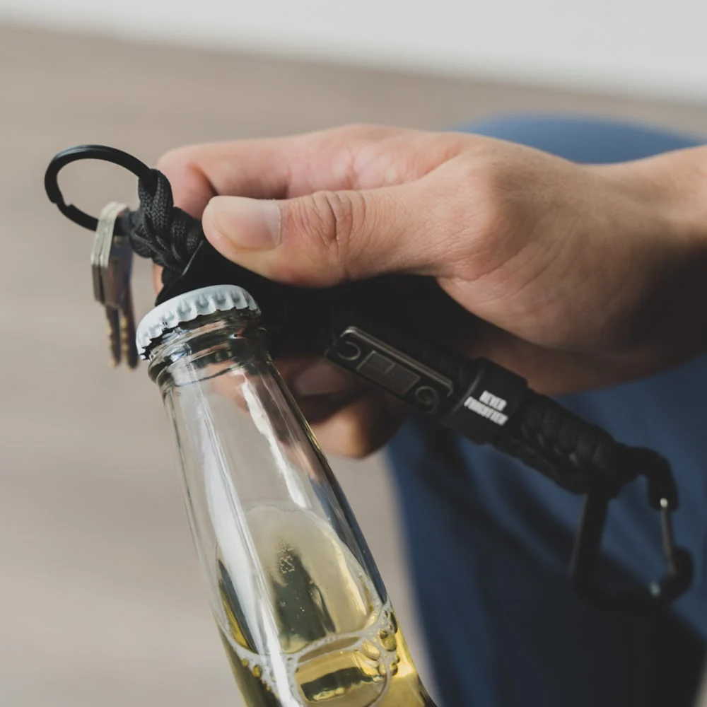 Never Forgotten Paracord Keychain Bottle Opener - Black - Image 3